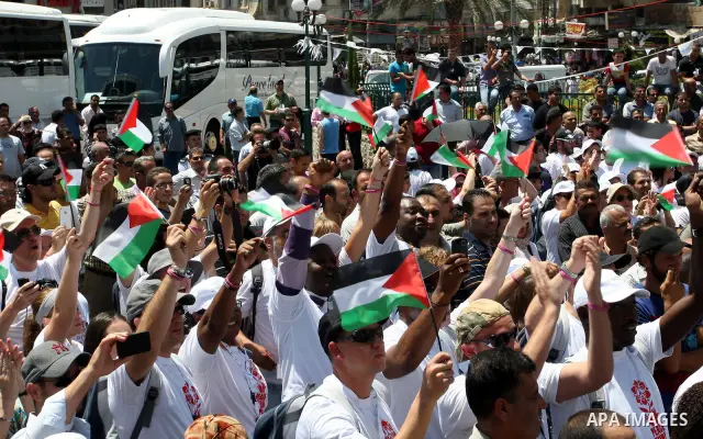 Foreign supporters with the Palestinian people take part in a demonstration in the West Bank city of Nablus, on Aug. 11, 2011. In support with the Palestinian people, where gather more than 1,200 activists from 22 foreig...
