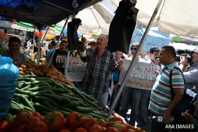 Palestinian activists hold a demonstration calling for boycotting the Israeli products from the Palestinian local markets in the West Bank city of Ramallah, on Aug. 11, 2011. Photo by Issam Rimawi