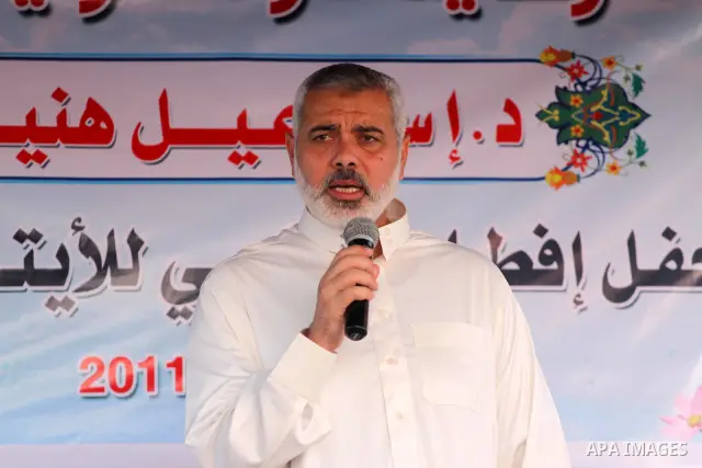 Palestinian Prime Minister in Gaza Strip, Ismail Haniya delivers speech during his participation the collective meal "Iftar" with the orphans in the holiest month of Ramadan, where sponsoring by the Interpal in Gaza city...