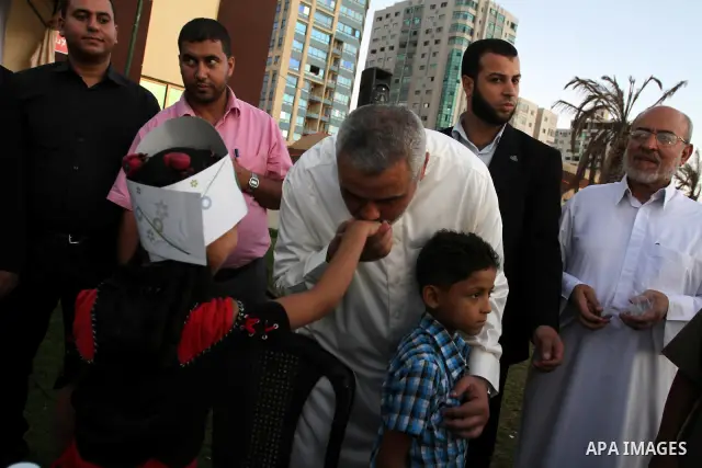 Palestinian Prime Minister in Gaza Strip, Ismail Haniya during his participation the collective meal "Iftar" with the orphans in the holiest month of Ramadan, where sponsoring by the Interpal in Gaza city on Aug. 11, 201...