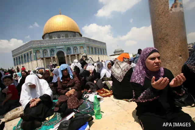 Palestinian Muslim women pray in front of the Dome of the Rock on the compound known to Muslims as al-Haram al-Sharif and to Jews as Temple Mount during the second Friday of the holy month of Ramadan in Jerusalem's Old C...