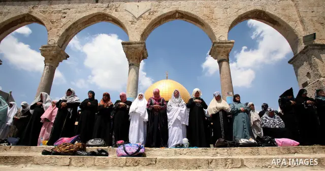 Palestinian Muslim women pray in front of the Dome of the Rock on the compound known to Muslims as al-Haram al-Sharif and to Jews as Temple Mount during the second Friday of the holy month of Ramadan in Jerusalem's Old C...