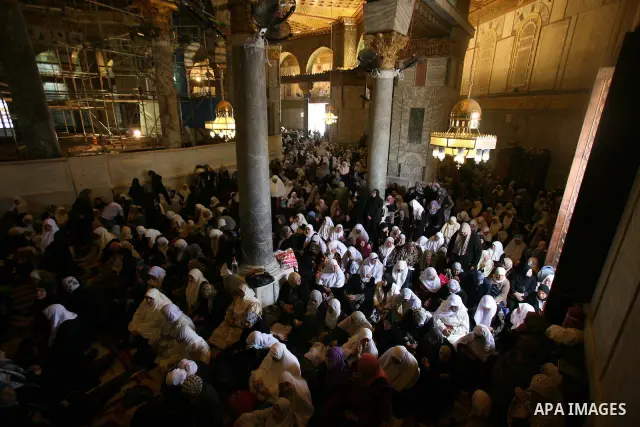 Palestinian Muslims pray in the Dome of the Rock on the compound known to Muslims as al-Haram al-Sharif and to Jews as Temple Mount during the second Friday of the holy month of Ramadan in Jerusalem's Old City on Aug. 12...