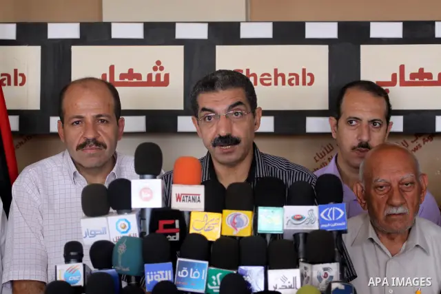 Committee monitoring of the UNRWA delivers speech during a press conference in Gaza city o Aug. 13, 2011. Photo by Mohammed Asad