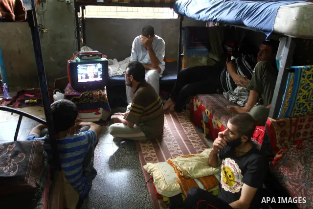 Palestinian prisoners watch television in a Hamas-run jail on the fourteenth day during the holy month of Ramadan in Gaza City on Aug. 14, 2011. Muslims around the world are observing the holy fasting month of Ramadan in...