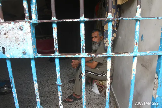 A Palestinian prisoner sits in a Hamas-run jail on the fourteenth day during the holy month of Ramadan in Gaza City on Aug. 14, 2011. Muslims around the world are observing the holy fasting month of Ramadan in which they...