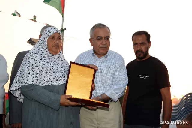 Palestinian Prime Minister Salam Fayyad, participates in the Ramadan breakfast for Journalists in West Bank City of Ramallah, on Aug 8, 2011. Photo by Mustafa Abu Dayeh