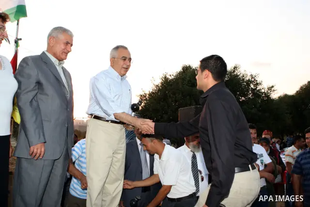 Palestinian Prime Minister Salam Fayyad, participates in the Ramadan breakfast for Journalists in West Bank City of Ramallah, on Aug 8, 2011. Photo by Mustafa Abu Dayeh