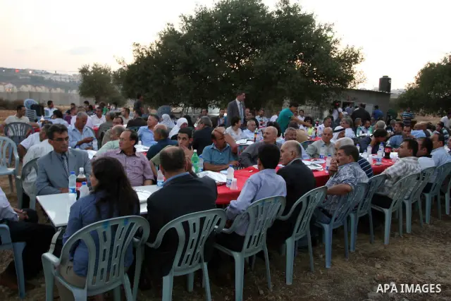 Palestinian Prime Minister Salam Fayyad, participates in the Ramadan breakfast for Journalists in West Bank City of Ramallah, on Aug 8, 2011. Photo by Issam Rimawi