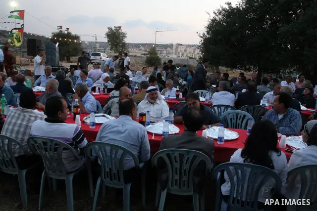 Palestinian Prime Minister Salam Fayyad, participates in the Ramadan breakfast for Journalists in West Bank City of Ramallah, on Aug 8, 2011. Photo by Issam Rimawi