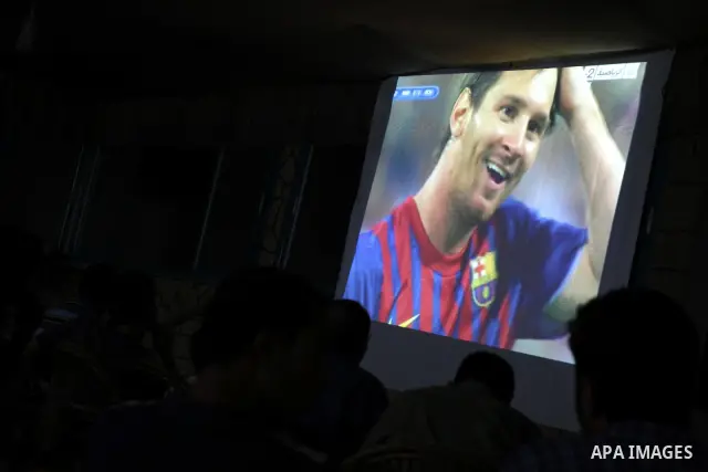 Palestinian Youths follow the match between Barcelona and Real Madrid Super Cup in a cafe yesterday evening in Gaza City on Aug. 14, 2011. Photo by Mohammed Asad