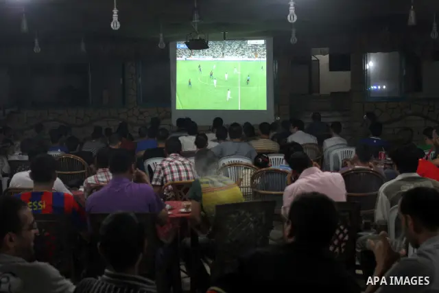 Palestinian Youths follow the match between Barcelona and Real Madrid Super Cup in a cafe yesterday evening in Gaza City on Aug. 14, 2011. Photo by Mohammed Asad