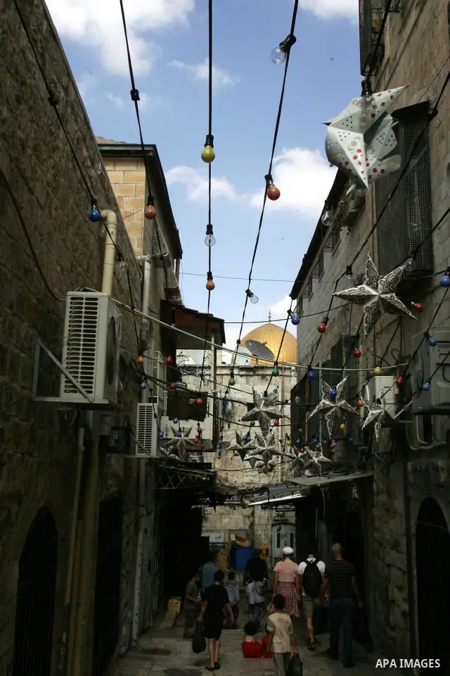 Palestinians walk in the neighborhoods in the Old City of Jerusalem during the holy month of Ramadan on Aug. 14, 2011. Muslims around the world are observing the holy fasting month of Ramadan in which they refrain from e...