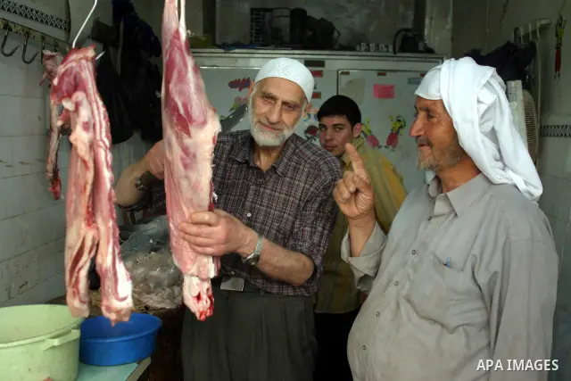 A Palestinian vendor sells meats in a butcher shop in the old city of the West Bank city of Hebron on Aug. 15, 2011. Muslims around the world abstain from eating, drinking and conducting sexual relations from sunrise to...