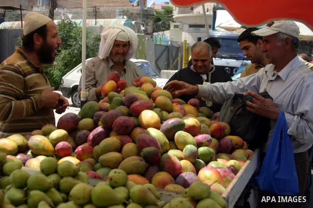 A Palestinian vendor sells fruits at a market in the West Bank city of Hebron on Aug. 15, 2011. Muslims around the world abstain from eating, drinking and conducting sexual relations from sunrise to sunset during Ramadan...