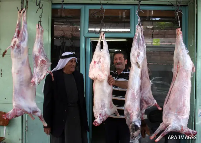 A Palestinian vendor sells meats in a butcher shop in the old city of the West Bank city of Hebron on Aug. 15, 2011. Muslims around the world abstain from eating, drinking and conducting sexual relations from sunrise to...