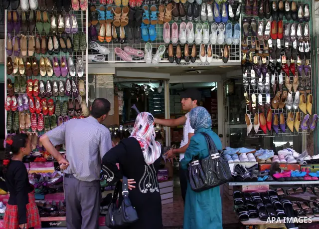 A Palestinian vendor sells Shoes at a shop in the West Bank city of Hebron on Aug. 15, 2011. Muslims around the world abstain from eating, drinking and conducting sexual relations from sunrise to sunset during Ramadan, t...