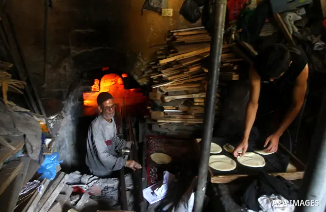A Palestinian baker prepares loaves of bread at his traditional bakery in the holy month of Ramadan in Gaza City on Aug. 15, 2011. Muslims around the world abstain from eating, drinking and conducting sexual relations fr...