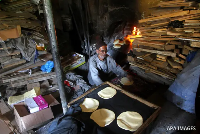 A Palestinian baker prepares loaves of bread at his traditional bakery in the holy month of Ramadan in Gaza City on Aug. 15, 2011. Muslims around the world abstain from eating, drinking and conducting sexual relations fr...