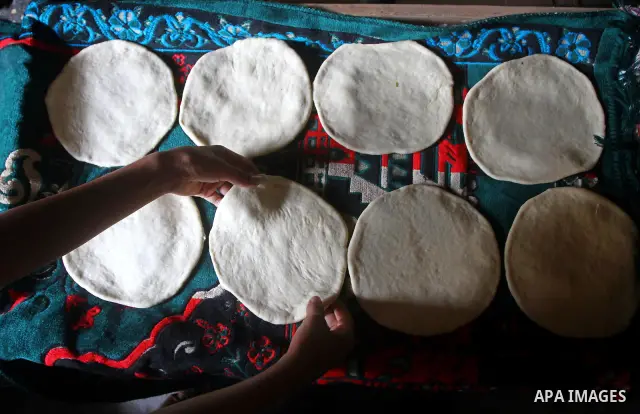 A Palestinian baker prepares loaves of bread at his traditional bakery in the holy month of Ramadan in Gaza City on Aug. 15, 2011. Muslims around the world abstain from eating, drinking and conducting sexual relations fr...