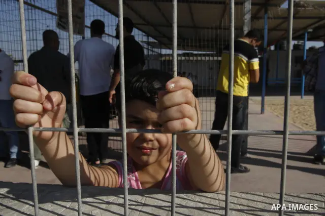 Palestinians Wait back of prisoner Belal Baker released from Israeli prisons at the Erez checkpoint in the northern Gaza Strip, following their release at the Erez crossing by Israeli border police, 15 August 2011. In to...