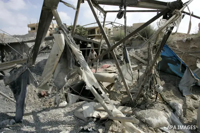 Palestinians inspect the damage outside a smuggling tunnel following an overnight Israeli airstrike in Rafah, on the border between Egypt and southern Gaza Strip, Tuesday on Aug. 16, 2011. after one Palestinian was kille...