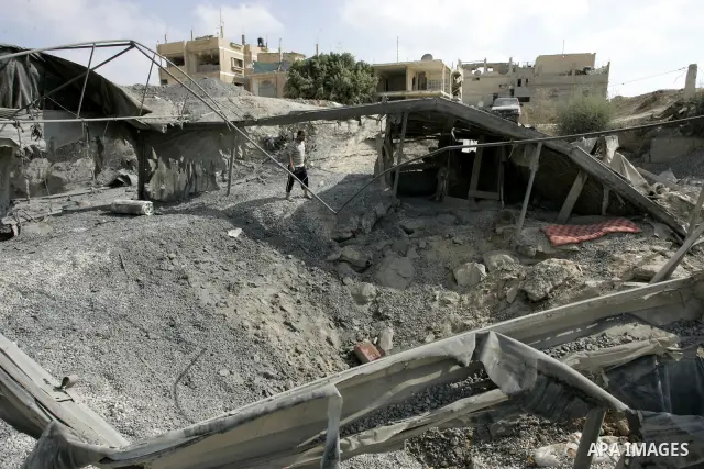 Palestinians inspect the damage outside a smuggling tunnel following an overnight Israeli airstrike in Rafah, on the border between Egypt and southern Gaza Strip, Tuesday on Aug. 16, 2011. after one Palestinian was kille...