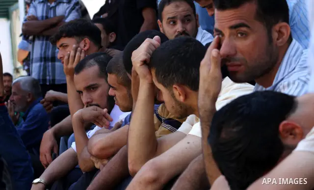 Relatives of Palestinian Hamas militant Moussa Shtewi, 29, mourn during his funeral in Gaza City, Tuesday, Aug. 16, 2011. Israeli aircraft struck five targets in the Hamas-ruled Gaza Strip on Tuesday, killing Shtewi and...