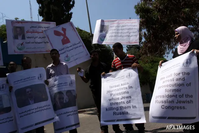 Palestinian journalists take part in a protest in support with the Russian journalist, Maxim infront of UNSCO in Gaza city on Aug. 16, 2011. where he threatened with death by one of the leaders of the Russian Jewish Cong...