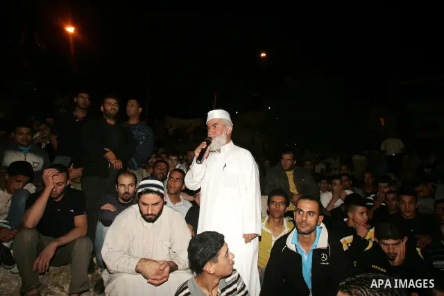 Relatives and friends of the Palestinian Amin Taleb Dabash, 32, mourn during his funeral in the village of Sur Baher in east Jerusalem on August 17,2011. Dabash was killed after an Israeli military jeep hit him . Photo b...
