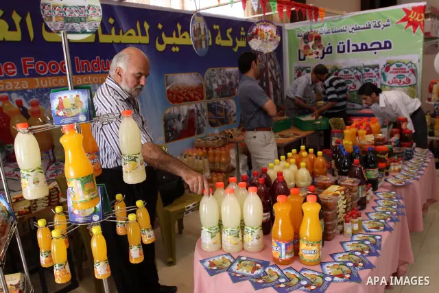 Palestinians participate in the opening of an exhibition of national products in Gaza city on Aug. 17, 2011 . Photo by Mohammed Asad