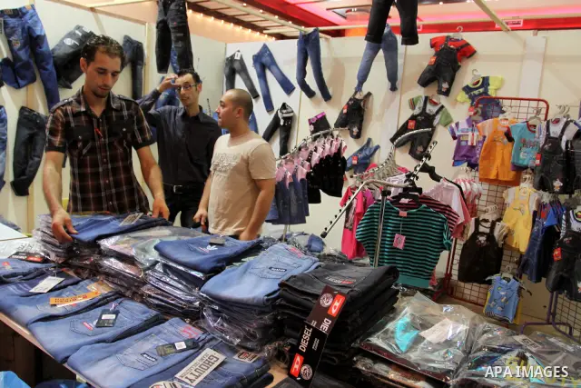 Palestinians participate in the opening of an exhibition of national products in Gaza city on Aug. 17, 2011 . Photo by Mohammed Asad