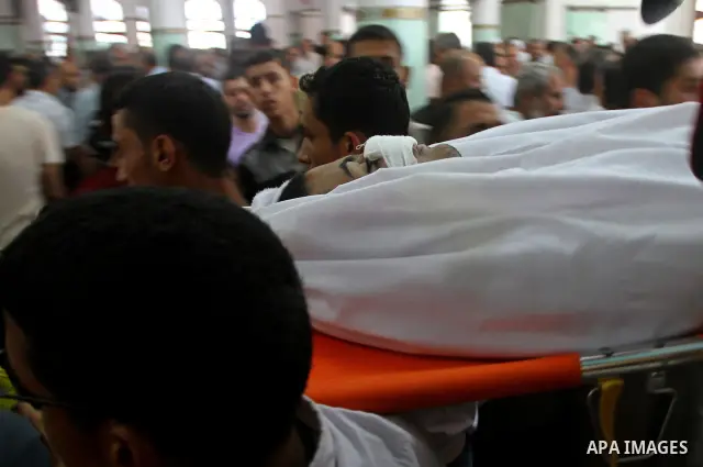 Palestinian mourners carry the body of Saed al Majdalawa during his funeral in the central Gaza Strip refugee camp of Nusseirat on August 17, 2011 a day after Israeli troops shot and killed him as he came near to the bor...