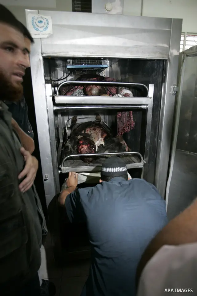 Palestinians react at a hospital after an Israeli air strike in Rafah in the southern Gaza Strip August 18, 2011. An Israeli air strike killed the leader of an armed Palestinian faction, a top lieutenant and three other...