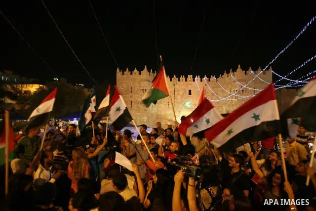 Dozens of Palestinians from Jerusalem protest in front of the Damascus Gate against the repression and massacres perpetrated by the Syrian regime against the Palestinian and Syrian people living in Syria, Jerusalem, on 1...