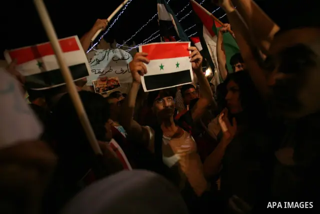 Dozens of Palestinians from Jerusalem protest in front of the Damascus Gate against the repression and massacres perpetrated by the Syrian regime against the Palestinian and Syrian people living in Syria, Jerusalem, on 1...