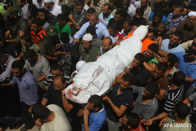 Palestinians carries the bodies of Kamal al-Nairab, the leader of an armed Palestinian faction, and other members during their funeral in Rafah in the southern Gaza Strip August 19, 2011. An Israeli air strike killed the...