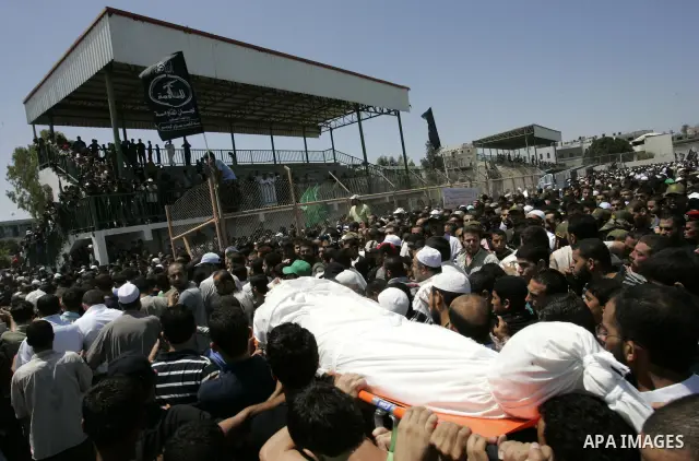 Palestinians attend the funeral of militant Kamal al-Nayrab, secretary-general of the Gaza-based group the Popular Resistance Committees (PRC) and five other people including a baby, killed in Israeli air strikes in the...