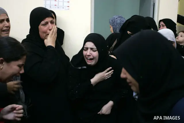 Palestinian relatives mourn during the funeral of the militant Kamal al-Nayrab, secretary-general of the Gaza-based group the Popular Resistance Committees (PRC), in the Rafah refugee camp, southern Gaza Strip, on August...