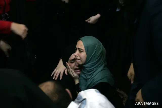 Palestinian relatives mourn during the funeral of the militant Kamal al-Nayrab, secretary-general of the Gaza-based group the Popular Resistance Committees (PRC), in the Rafah refugee camp, southern Gaza Strip, on August...