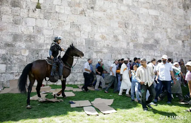 Muslim worshippers run away from Israeli mounted policemen after trying to cross a police barrier near Damascus Gate in Jerusalem's Old City during the third Friday of the holy month of Ramadan August 19, 2011. Israeli s...
