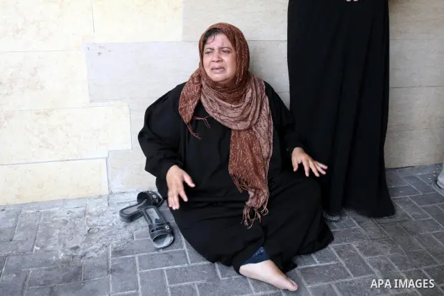 A Palestinian woman reacts outside a hospital after her son was wounded in an Israeli air strike in Gaza City August 20, 2011. The Arab League will hold an urgent meeting on Sunday to discuss an Israeli air strike on the...