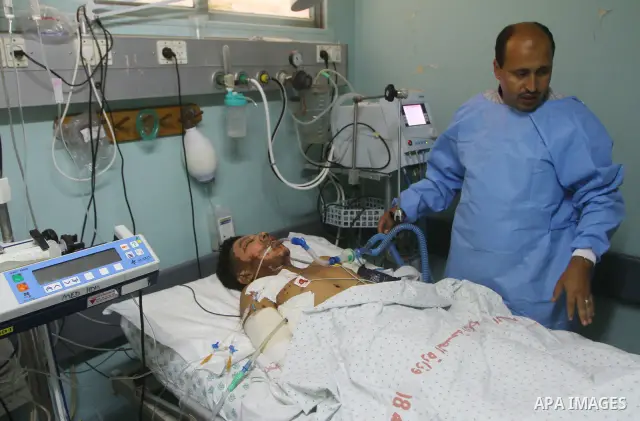 Mohammed Al-Zaza, seventeen-years-old wounded Palestinian boy, receives a treatment inside the intensive care unit in al-Shefa hospital in Gaza City, Aug. 21, 2011. So far 15 Palestinians including three children were ki...
