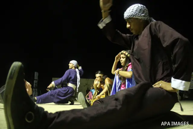Palestinian dancers perform the popular 'Dabka' during a celebration in solidarity with the Palestinian prisoners inside the Israeli jails in the West Bank city of Nablus, Aug. 20, 2011. Photo by Wagdi Eshtayah