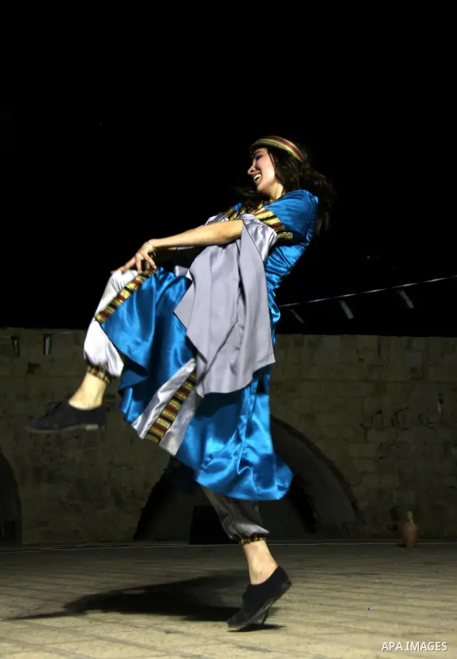 Palestinian dancers perform the popular 'Dabka' during a celebration in solidarity with the Palestinian prisoners inside the Israeli jails in the West Bank city of Nablus, Aug. 20, 2011. Photo by Wagdi Eshtayah