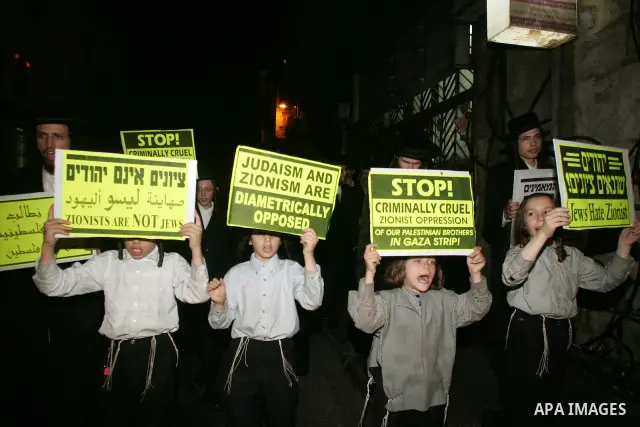Ultra Orthodox Haredi Jews of the Neturei Karta group take part in a protest against Israeli attacks over Gaza Strip in the west of Jerusalem on Aug. 21, 2011. Photo by Mahfouz Abu Turk