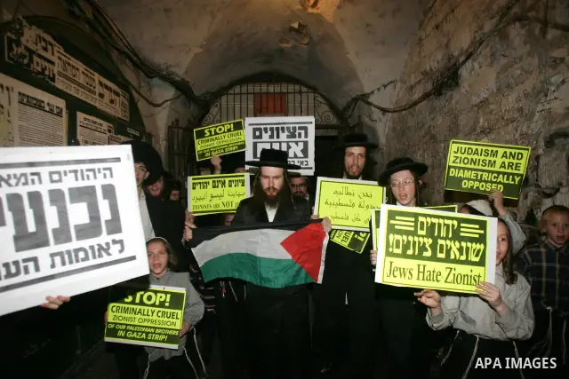 Ultra Orthodox Haredi Jews of the Neturei Karta group take part in a protest against Israeli attacks over Gaza Strip in the west of Jerusalem on Aug. 21, 2011. Photo by Mahfouz Abu Turk