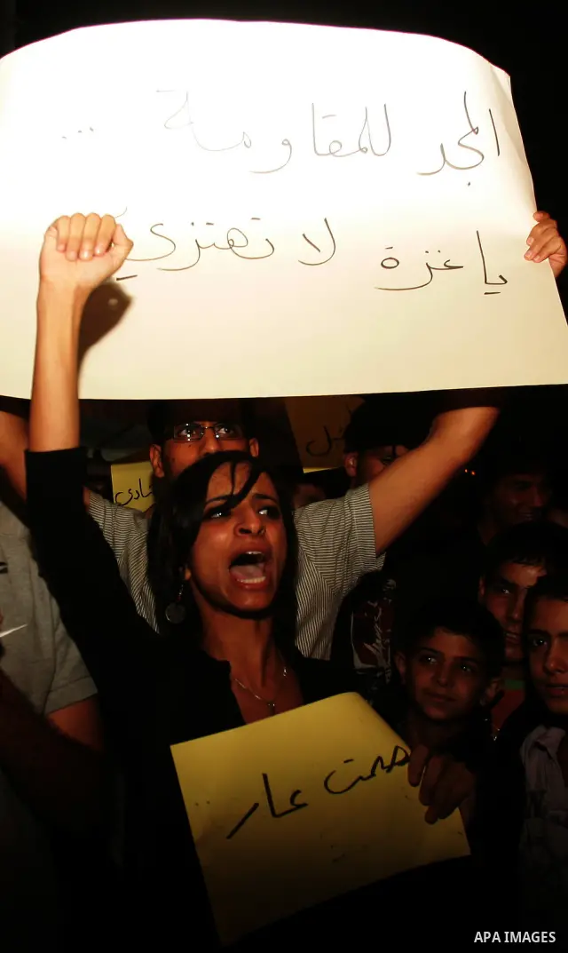 Protesters from several anti-war and pro-Palestinian groups gather at Damascus Gate of the Old City of Jerusalem on Aug. 21, 2011, to protest the disproportionate use of force by the Israeli armed forces during air-strik...