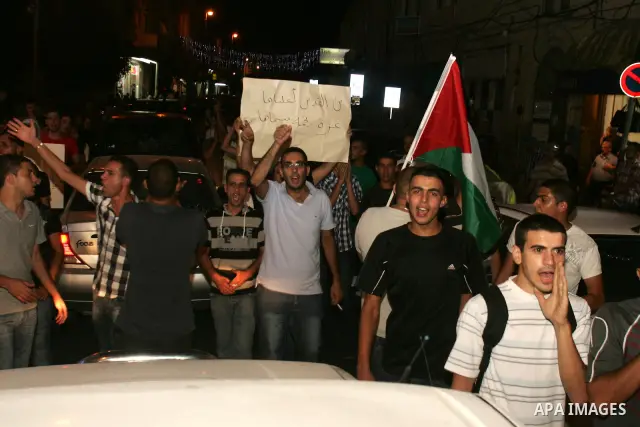 Protesters from several anti-war and pro-Palestinian groups gather at Damascus Gate of the Old City of Jerusalem on Aug. 21, 2011, to protest the disproportionate use of force by the Israeli armed forces during air-strik...