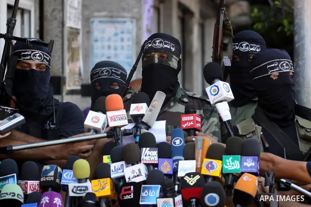 Palestinian militants of the Nasser Salah al-Din Brigades, delivers speech in a press conference, in Gaza city on Aug. 22, 2011. Photo by Mohammed Asad
